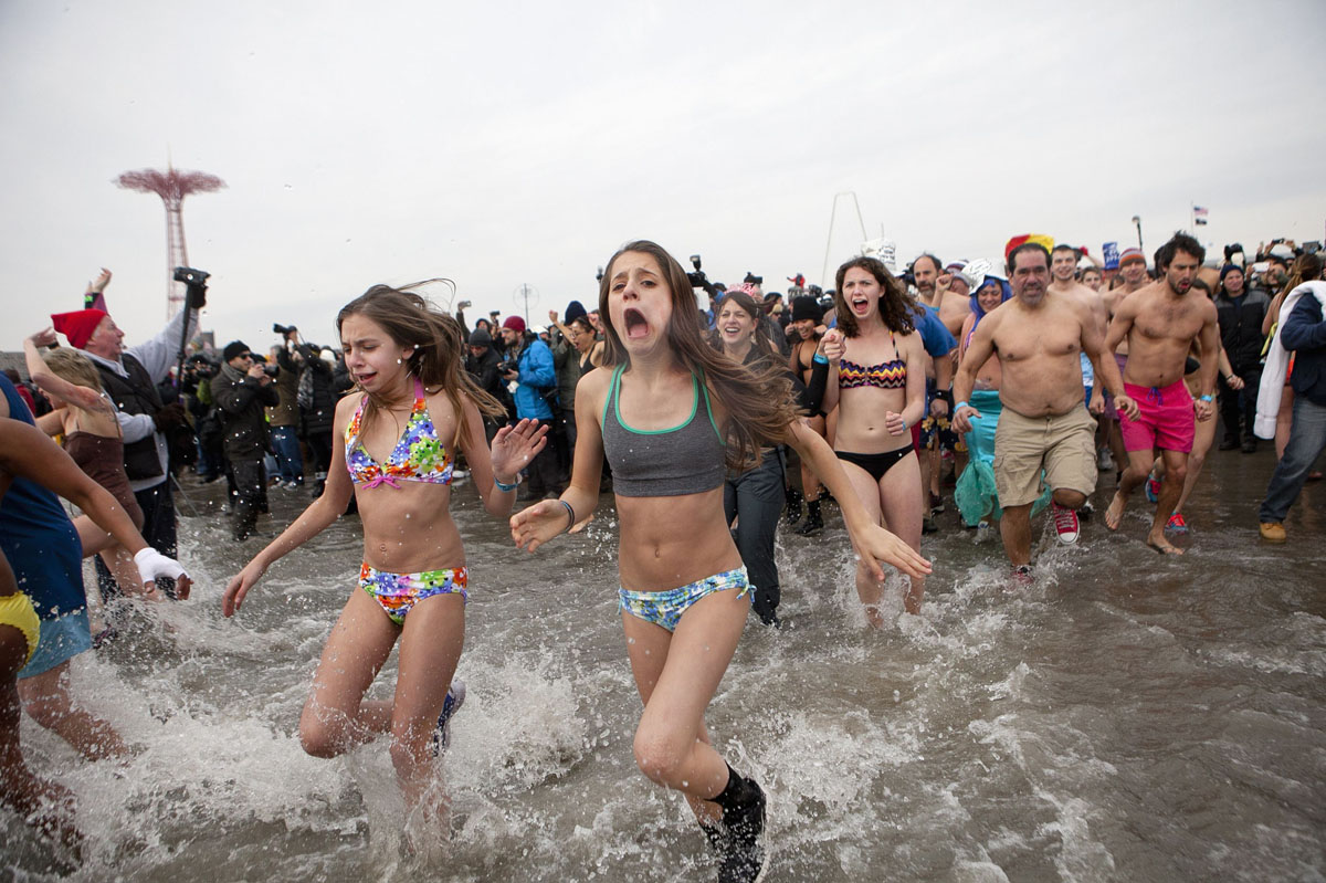 People participate in the annual Coney Island Polar Bear Club dip in the Brooklyn borough of New York